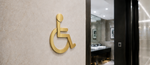 DUROSIGN WASHROOM SIGN FOR DISABLE - STAINLESS STEEL GOLD BRUSH FINISH CUTOUT WITH ACRYLIC BACKING